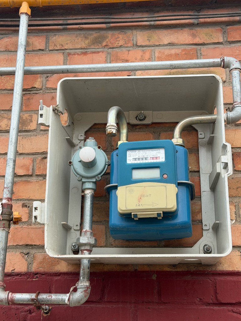 Smart gas meter (NB-IoT) on a brick wall