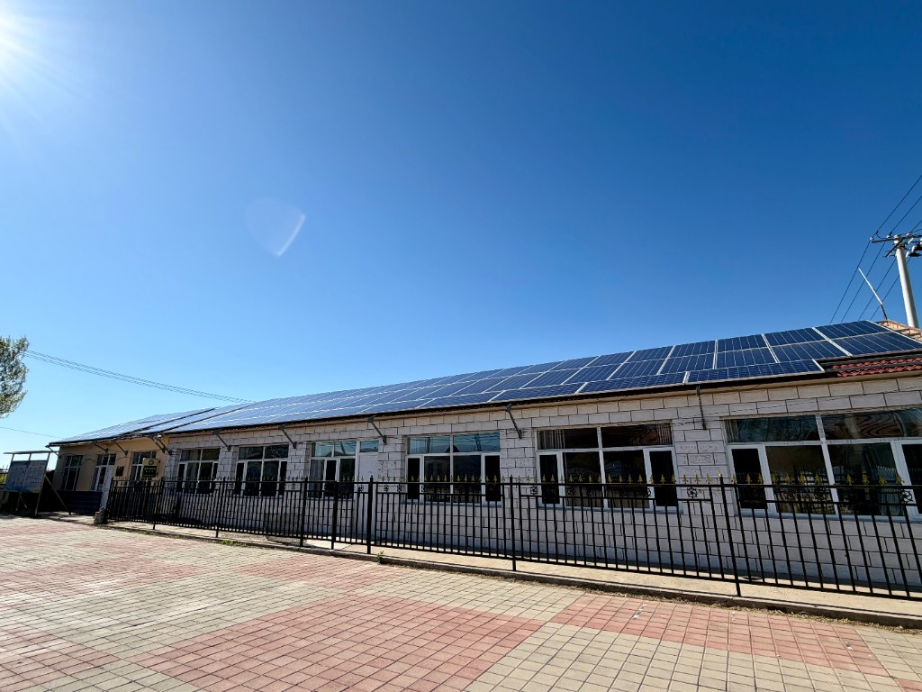 Rooftop solar array on a building photographed for the project